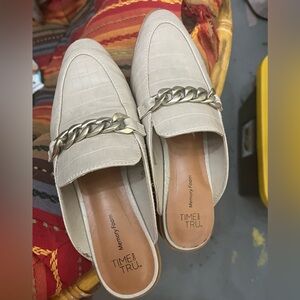 Bone color mules with a silver chain detail